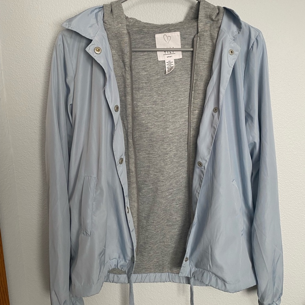 light blue/gray windbreaker